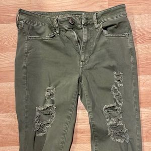 Green american eagle ripped skinny jeans